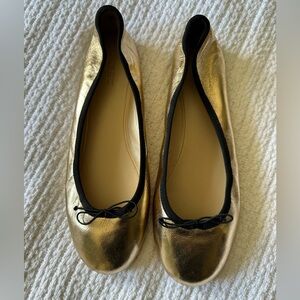 J. Crew metallic gold ballet flats with black trim